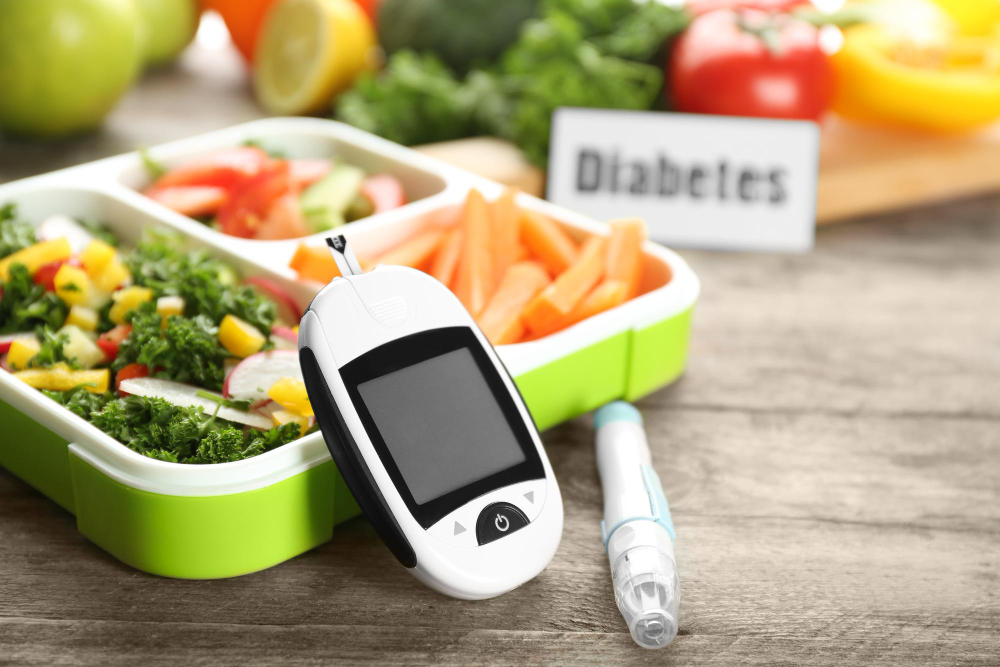 digital-glucometer-lancet-pen-lunch-box-with-vegetables-table-diabetes-diet